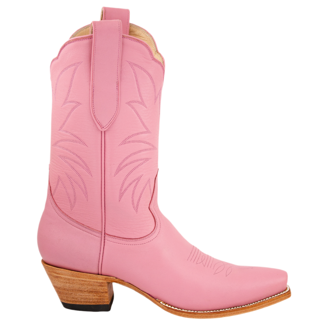 A pink mid-calf boot with a 2-inch stacked heel and Heirloom Field's signature double scallop top. The boot features tone-on-tone stitching and a leather toe box.