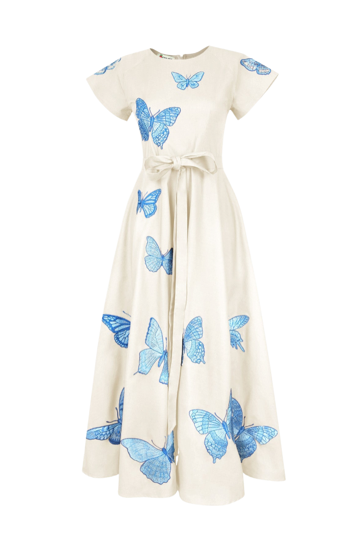 An off-white maxi dress with short flutter sleeves, featuring a self-tie waist and an all-over print of blue butterflies, shown against a plain white background.