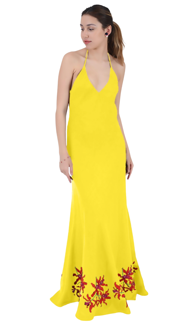 Woman wearing a yellow halter neck dress with floral embroidery on a white background